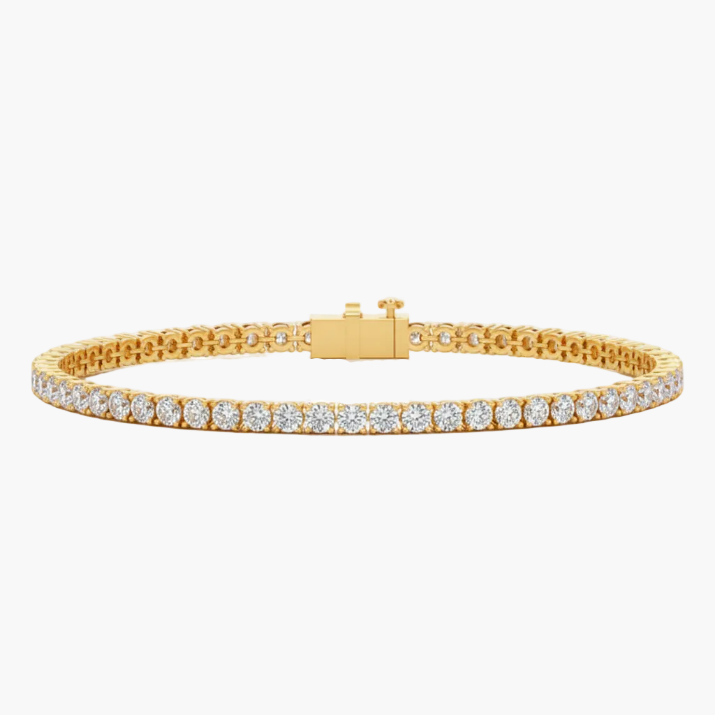 Gold bracelet with diamonds on a light gray background