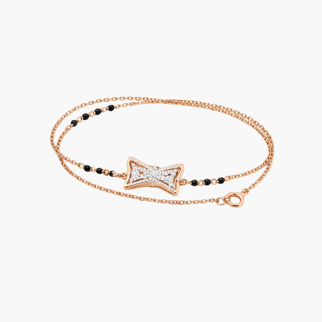 Rose gold bracelet with star-shaped clasp and black beads on a white background