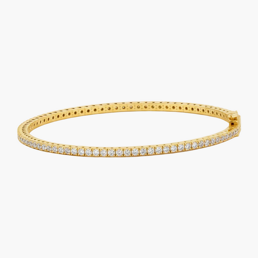 Gold bracelet with diamonds on a white background