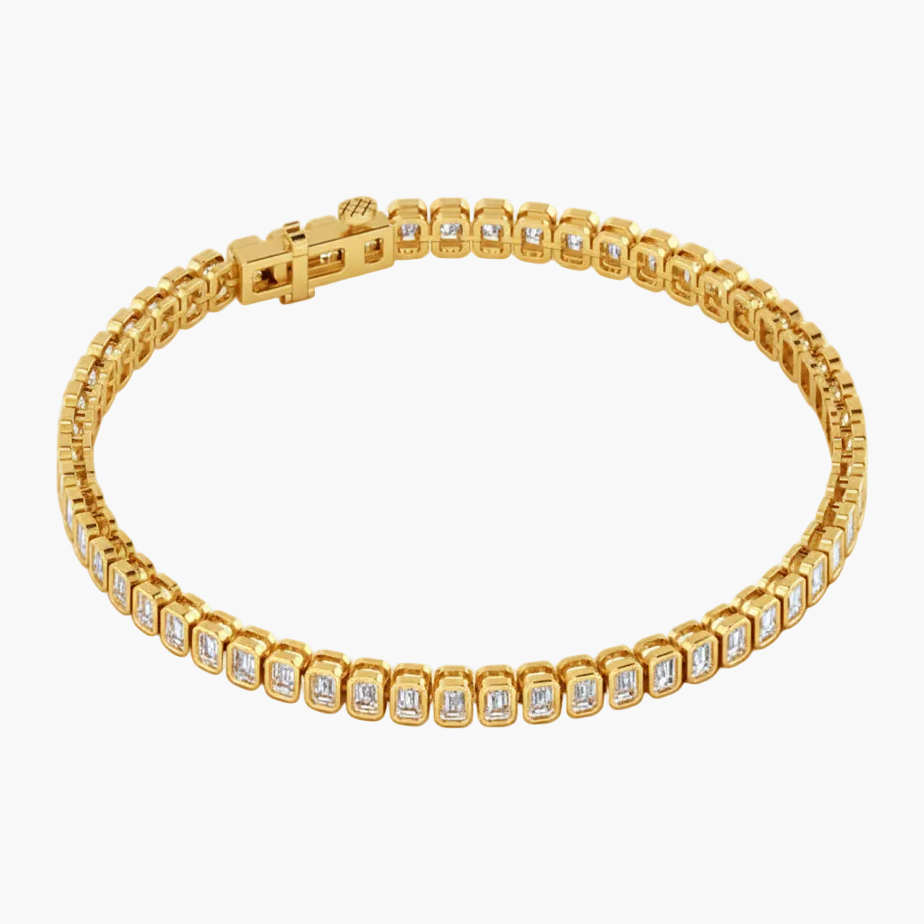 Gold bracelet with diamond accents on a white background