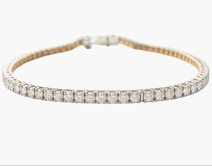 Gold bracelet with diamonds on a white background