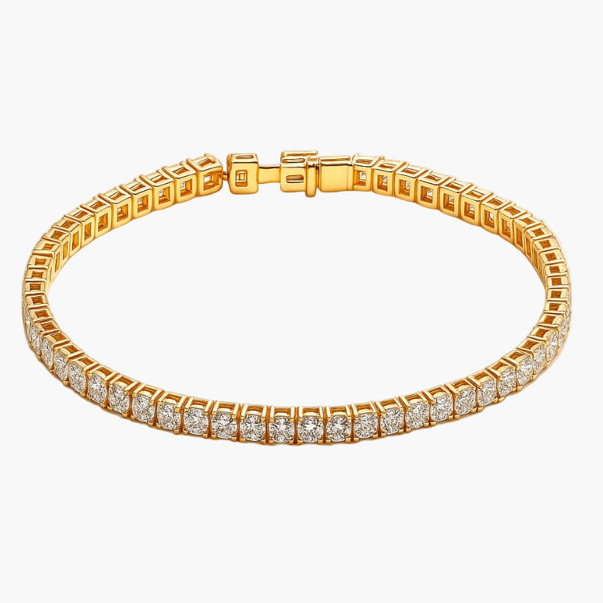 Gold bracelet with diamond accents on a white background
