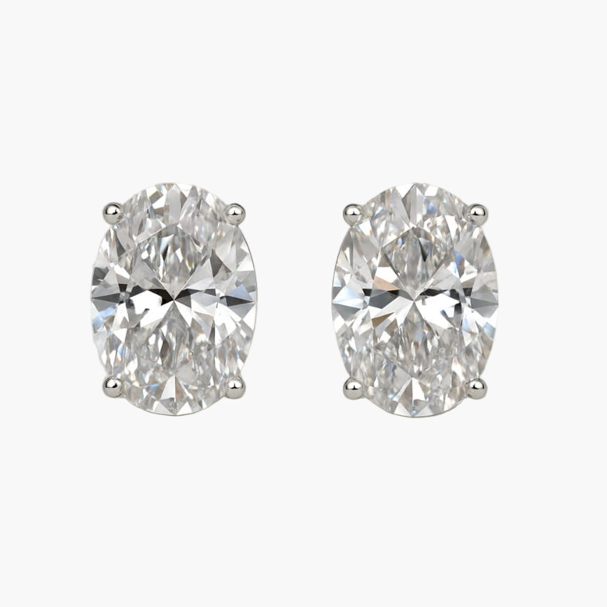 Pair of diamond earrings on a white background