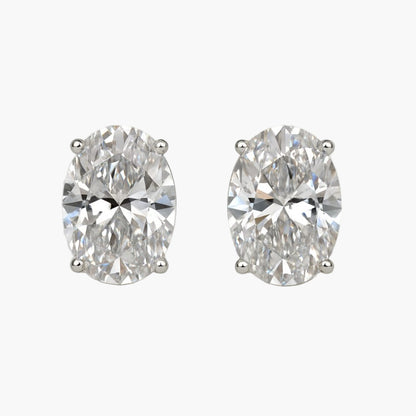 Pair of diamond earrings on a white background