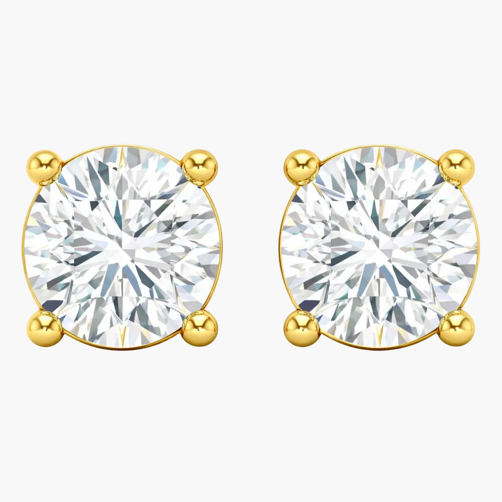 Gold earrings with round clear gemstones on a white background