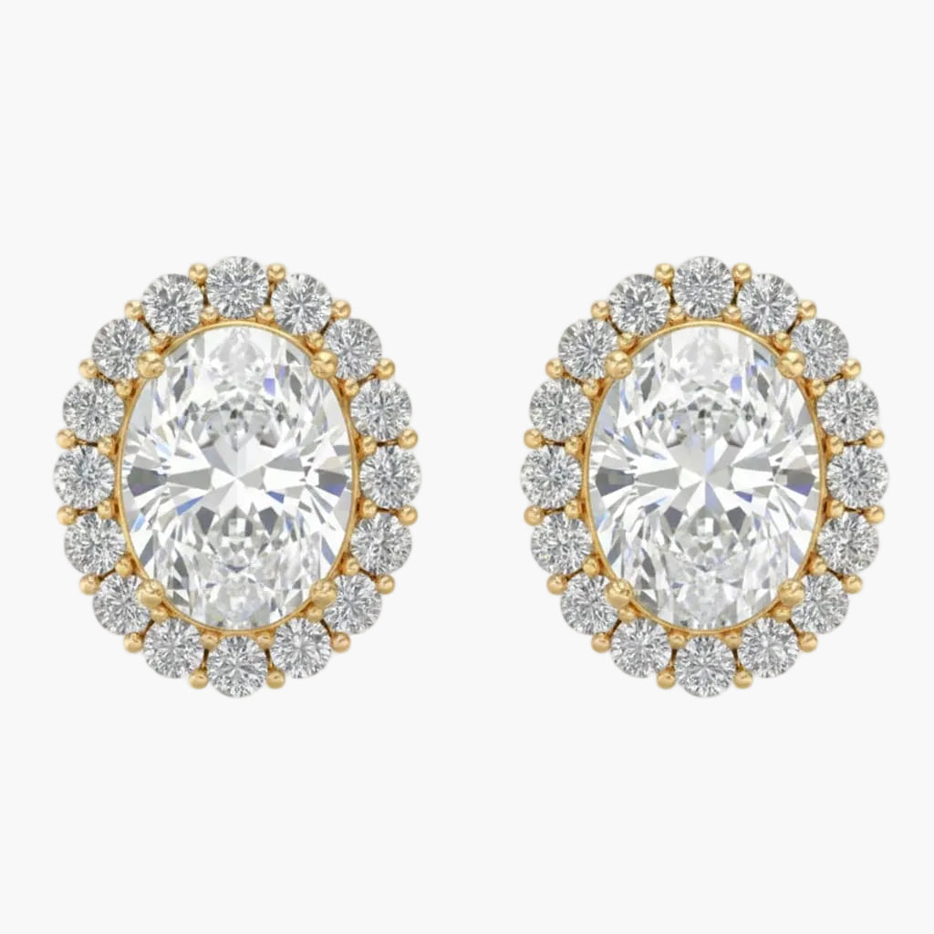 Pair of gold and diamond earrings on a white background