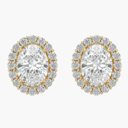 Pair of gold and diamond earrings on a white background