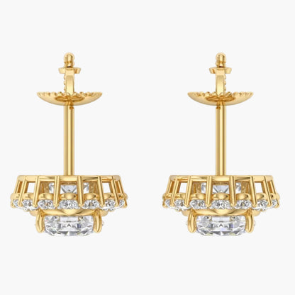 Gold earrings with clear gemstones on a white background