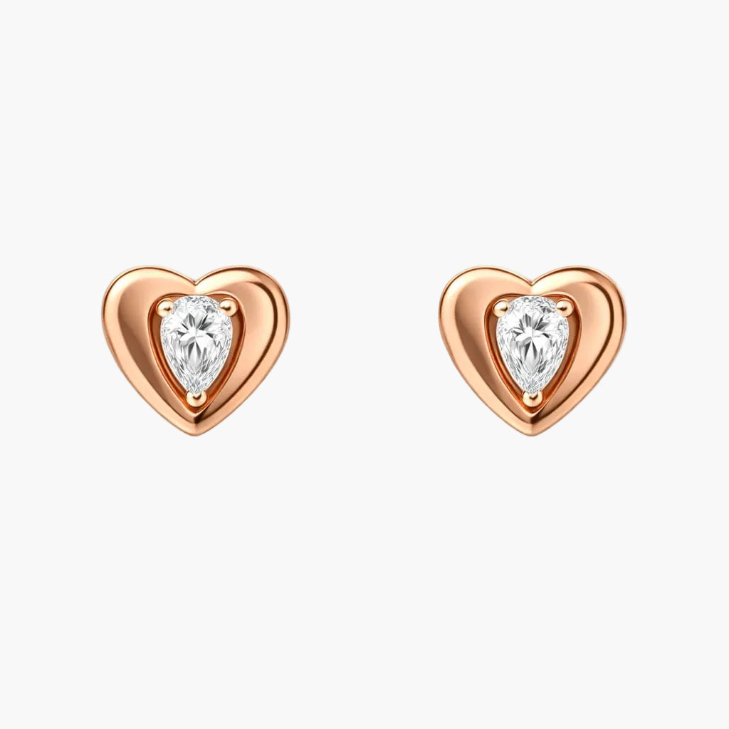Heart-shaped earrings with clear gemstones on a white background