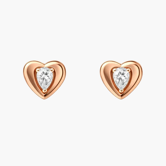 Heart-shaped earrings with clear gemstones on a white background