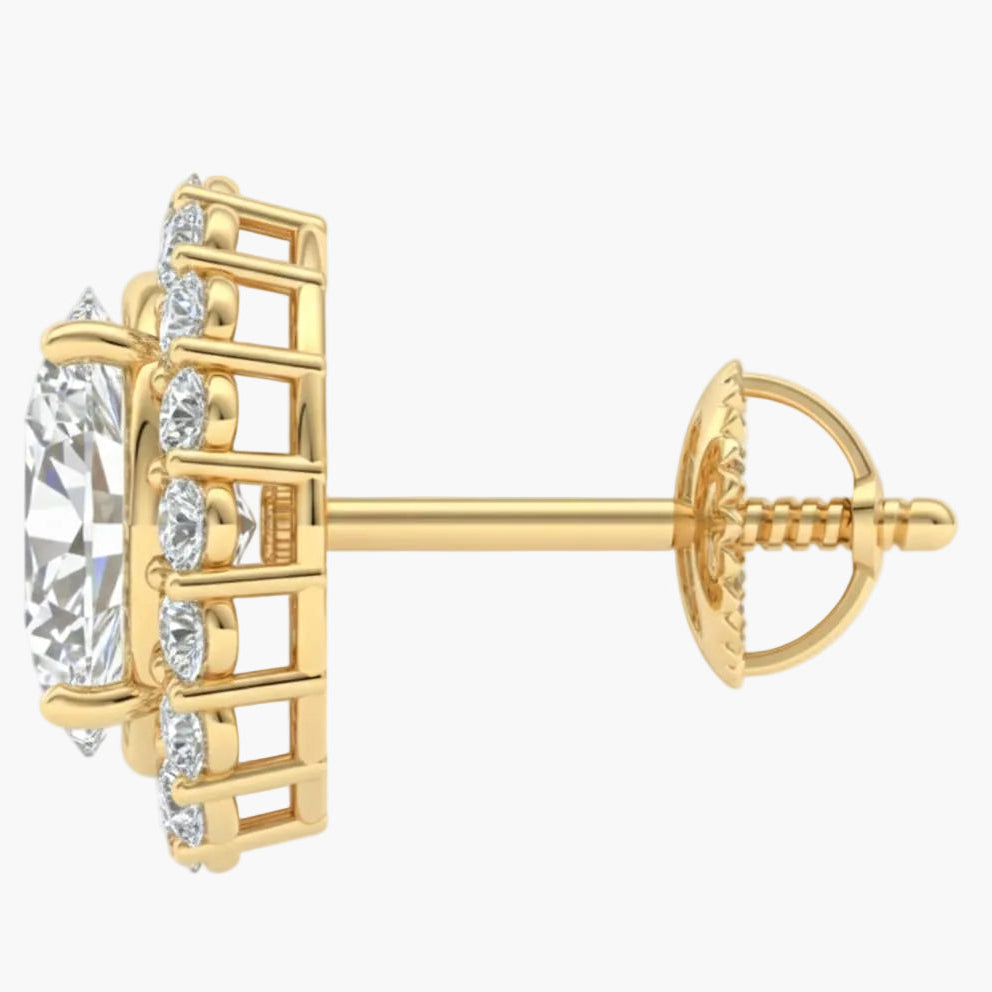 Gold earring with clear gemstone on a white background
