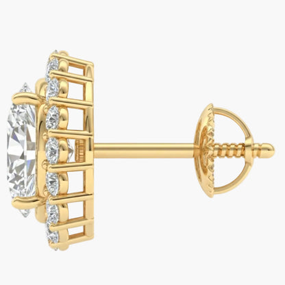 Gold earring with clear gemstone on a white background