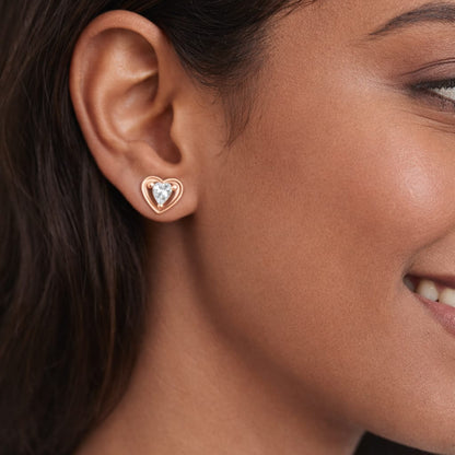 Close-up of a woman wearing a heart-shaped earring.