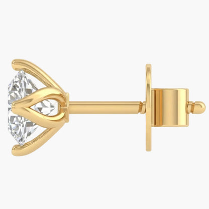 Gold earring with a clear gemstone on a white background