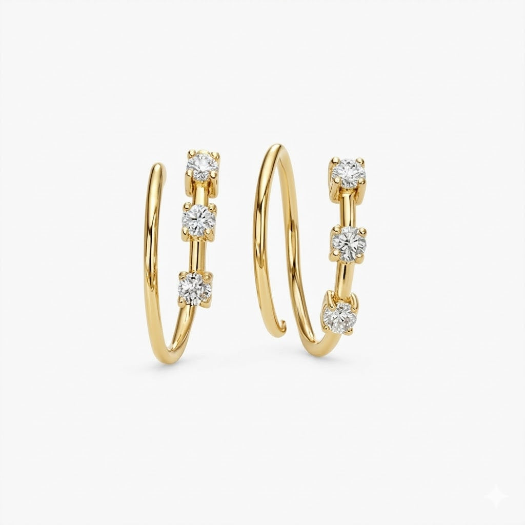 Gold hoop earrings with embedded diamonds on a white background