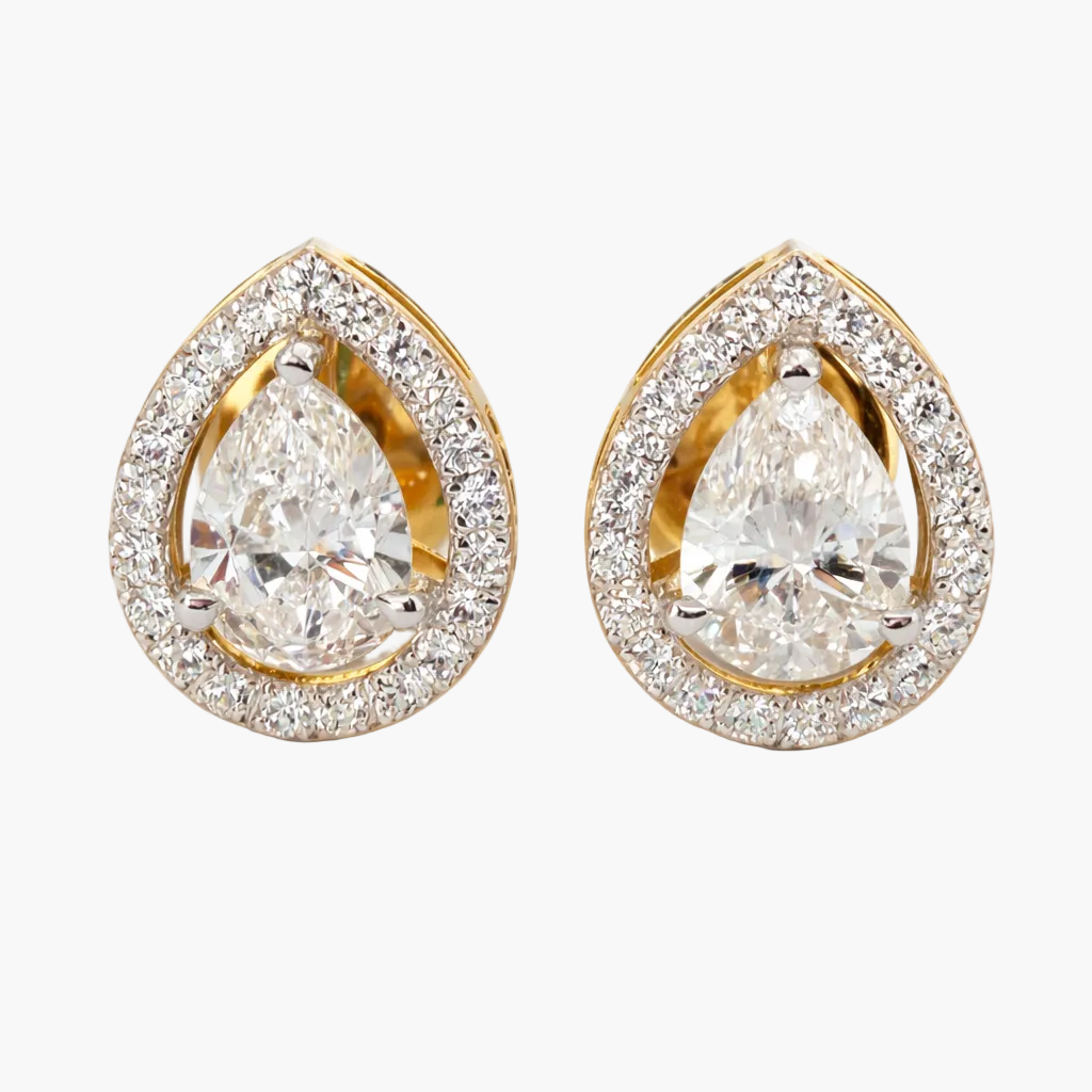 Pair of gold and diamond teardrop earrings on a white background