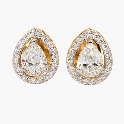 Pair of gold and diamond teardrop earrings on a white background
