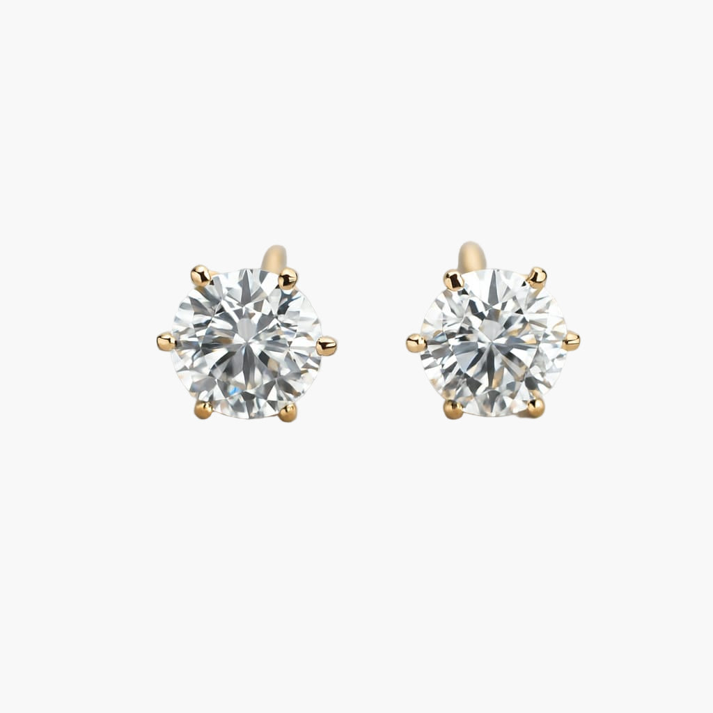 Pair of diamond stud earrings on a white background