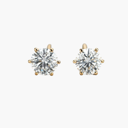 Pair of diamond stud earrings on a white background