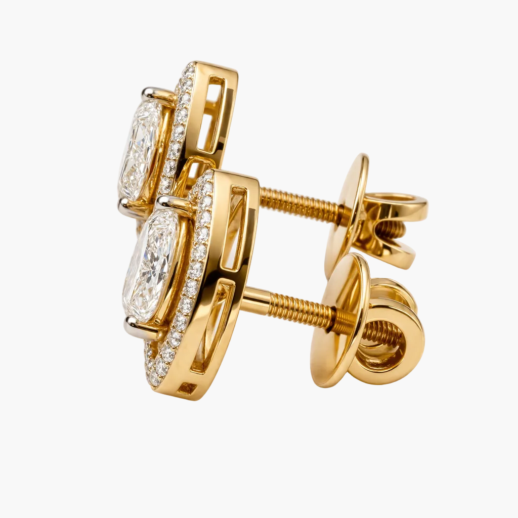 Gold earrings with diamond-like stones on a white background