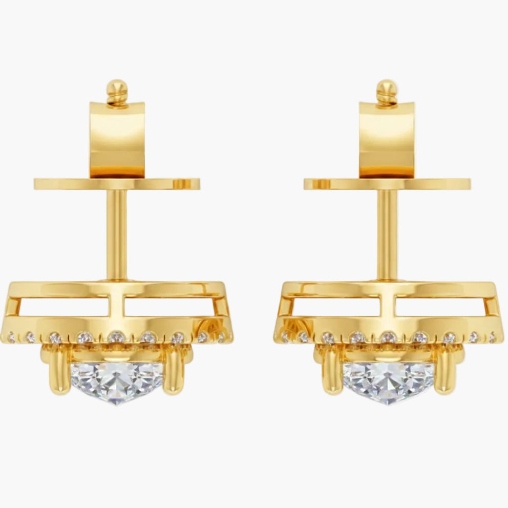 Gold earrings with clear gemstones on a white background