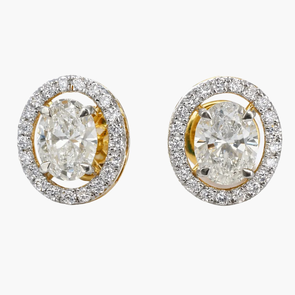 Pair of diamond earrings with gold and silver accents on a white background