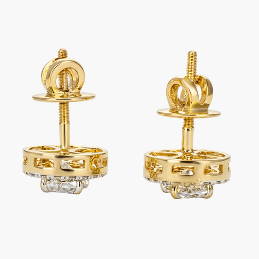Pair of gold earrings on a white background