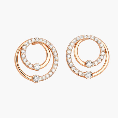 Rose gold earrings with circular design and embedded diamonds on a white background