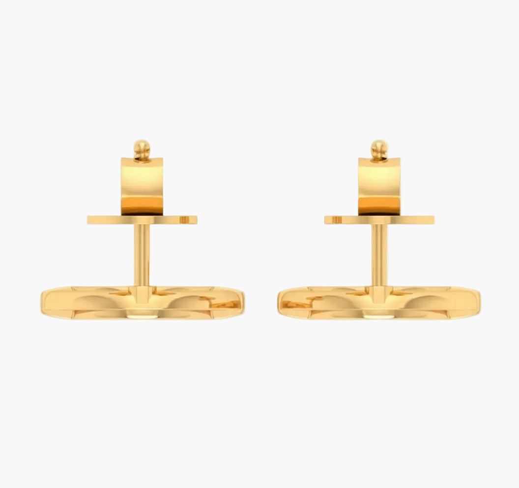 Pair of gold cufflinks on a white background
