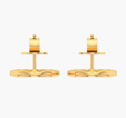 Pair of gold cufflinks on a white background