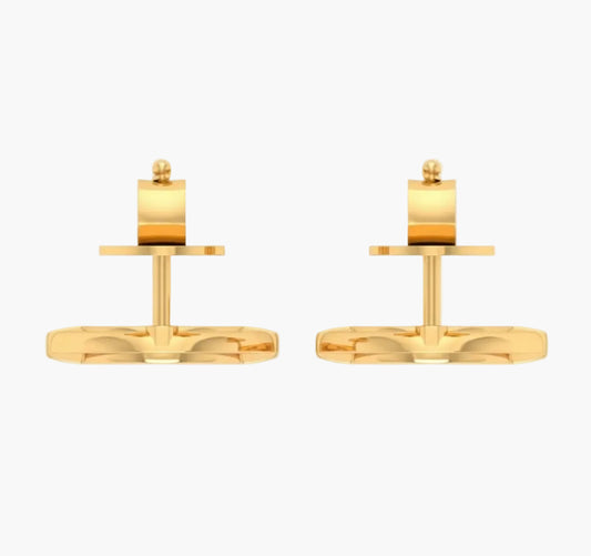 Pair of gold cufflinks on a white background