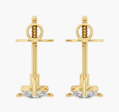 Gold earrings with intricate designs on a white background