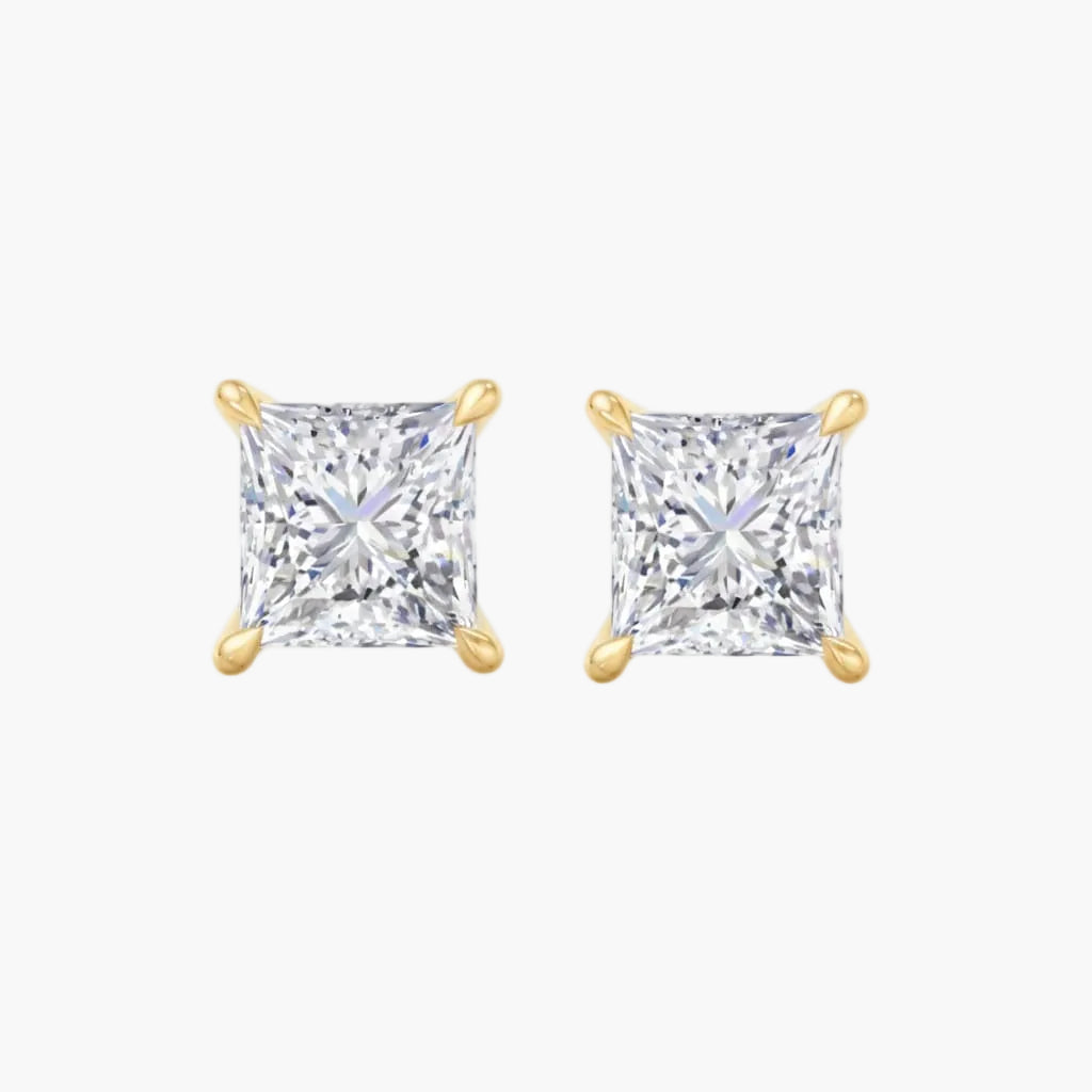 Pair of gold square-cut stud earrings on a white background