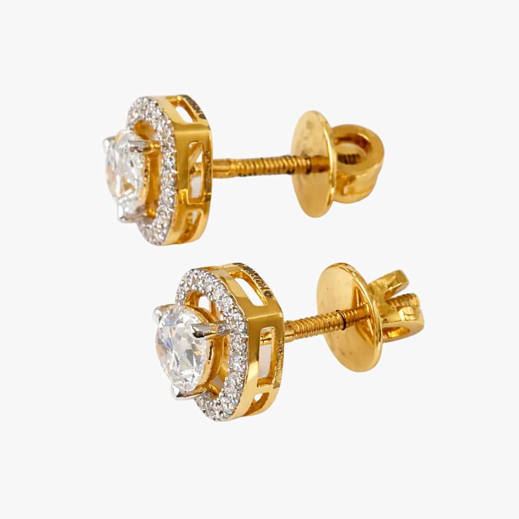Gold earrings with clear gemstones on a white background