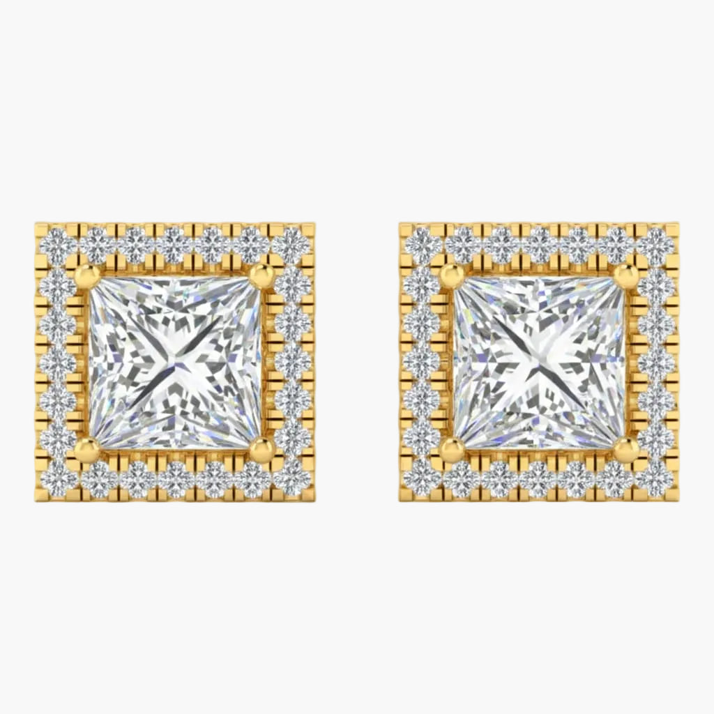 Pair of square diamond earrings with gold frames on a white background