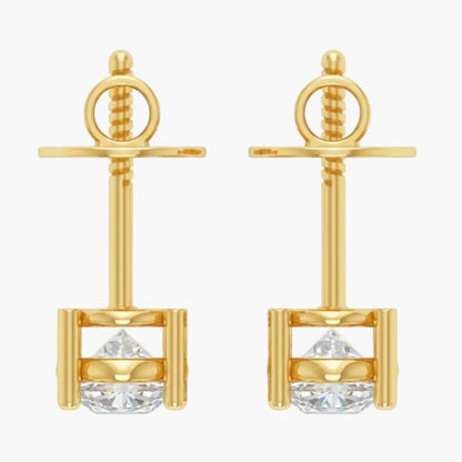 Gold earrings with clear gemstones on a white background