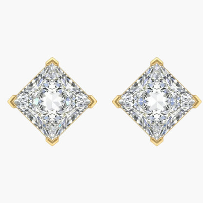 Pair of diamond earrings with gold prongs on a white background