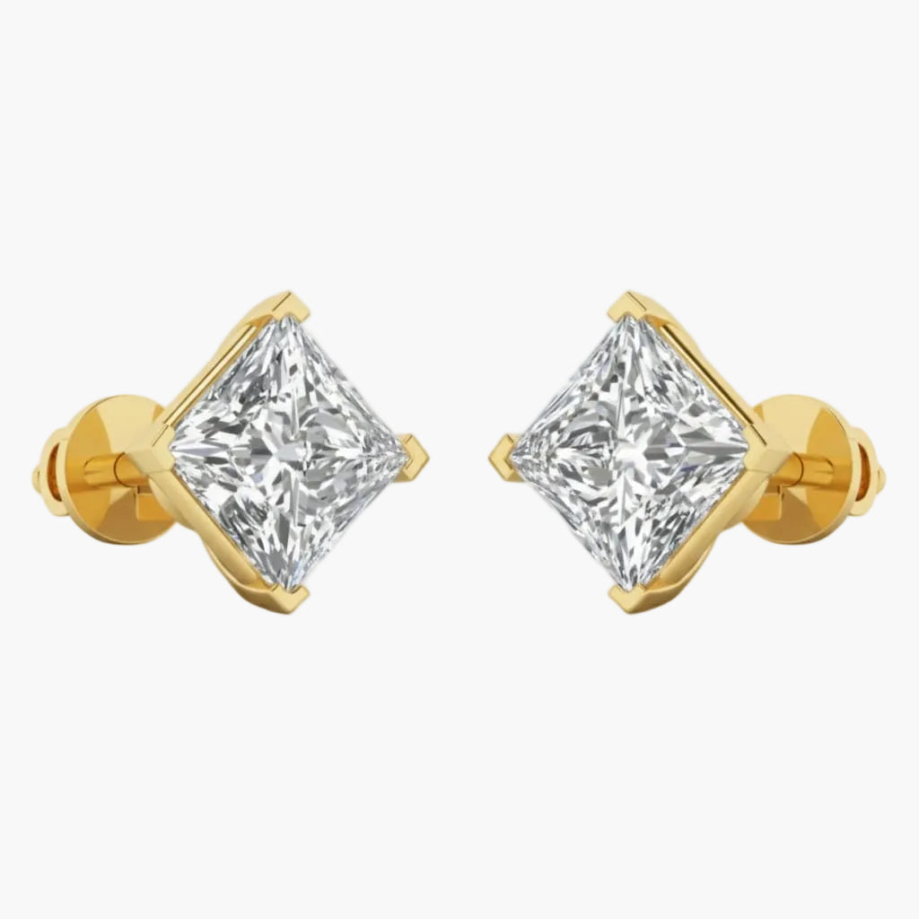 Gold earrings with clear gemstones on a white background