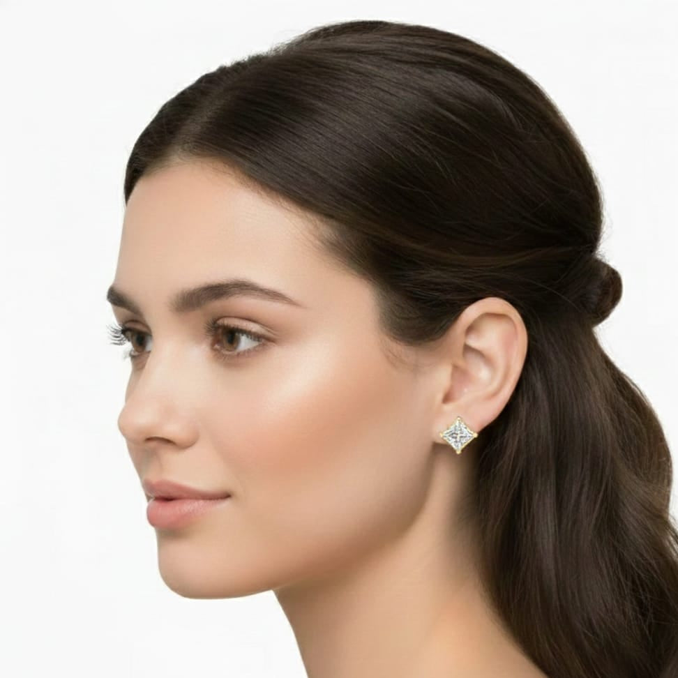 Woman wearing a diamond earring on a white background