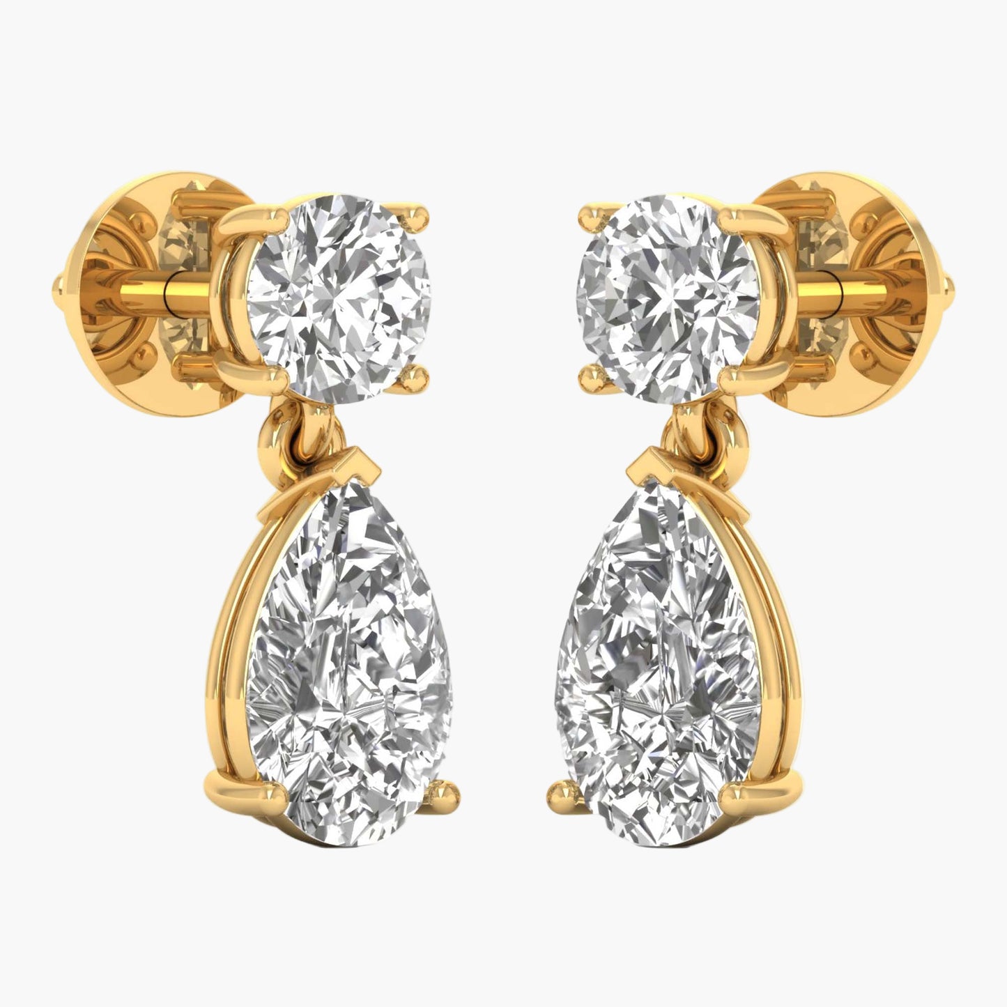 Gold earrings with clear gemstones on a white background