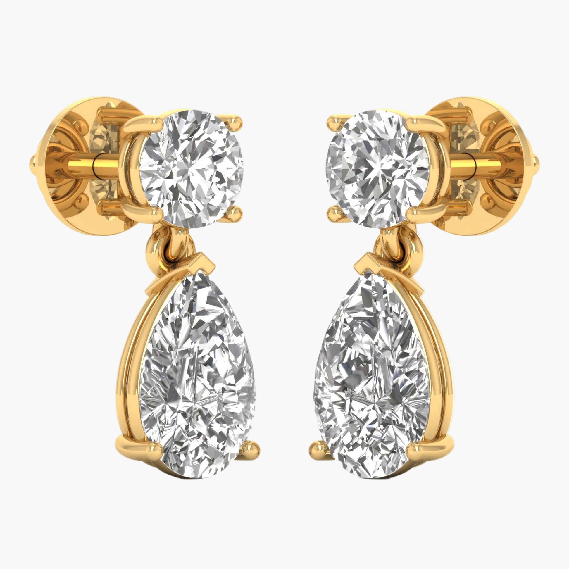 Gold earrings with clear gemstones on a white background