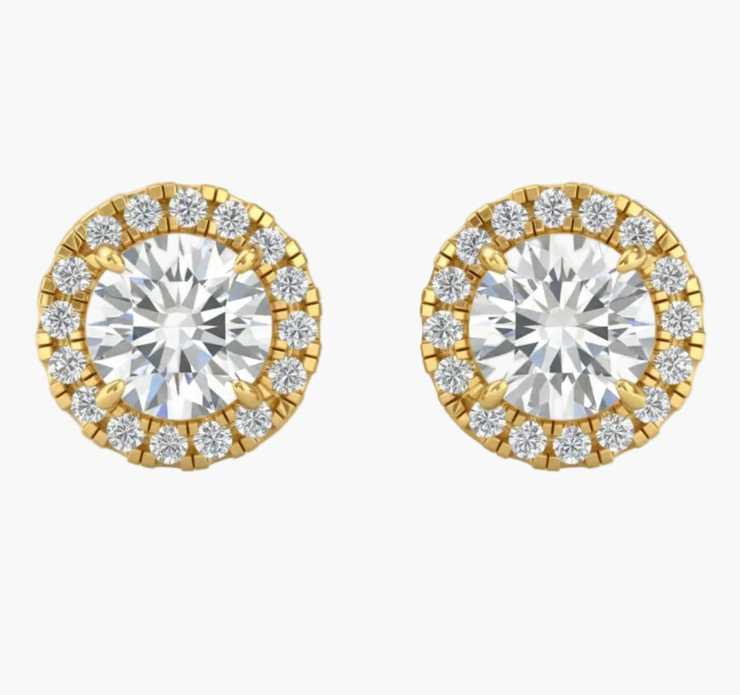Pair of gold and diamond stud earrings on a white background