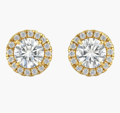 Pair of gold and diamond stud earrings on a white background