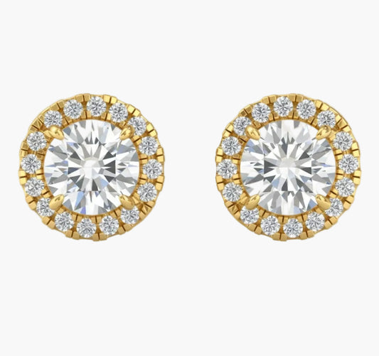 Pair of gold and diamond stud earrings on a white background