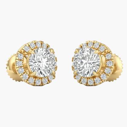Gold earrings with large central gemstones and smaller stones around on a white background