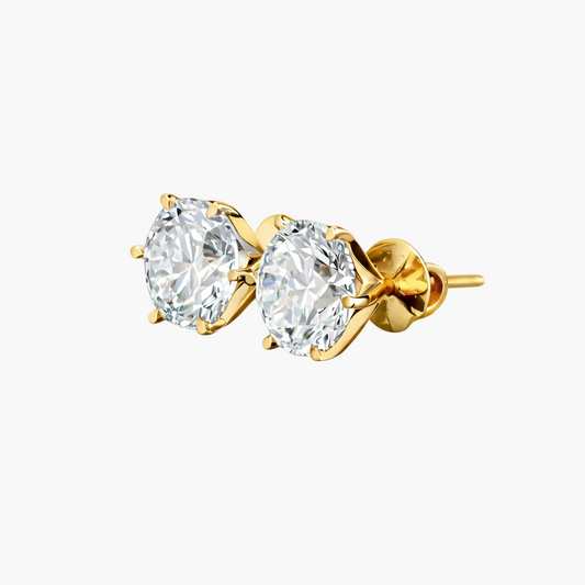 Gold earrings with clear gemstones on a white background