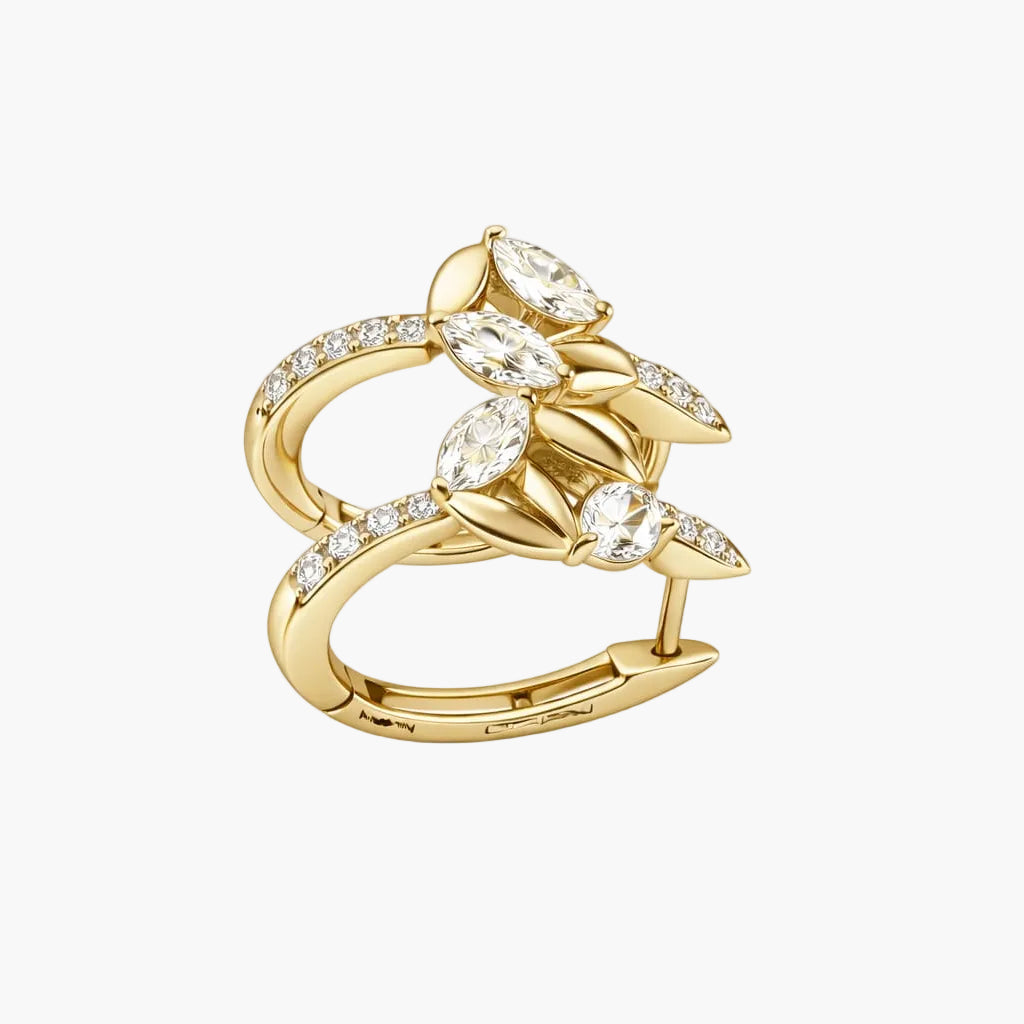 Gold ring with diamond accents on a white background