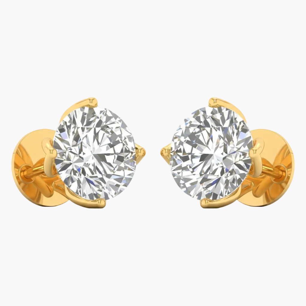 Gold earrings with large clear gemstones on a white background