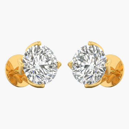 Gold earrings with large clear gemstones on a white background