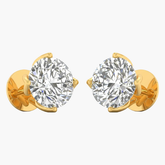 Gold earrings with large clear gemstones on a white background